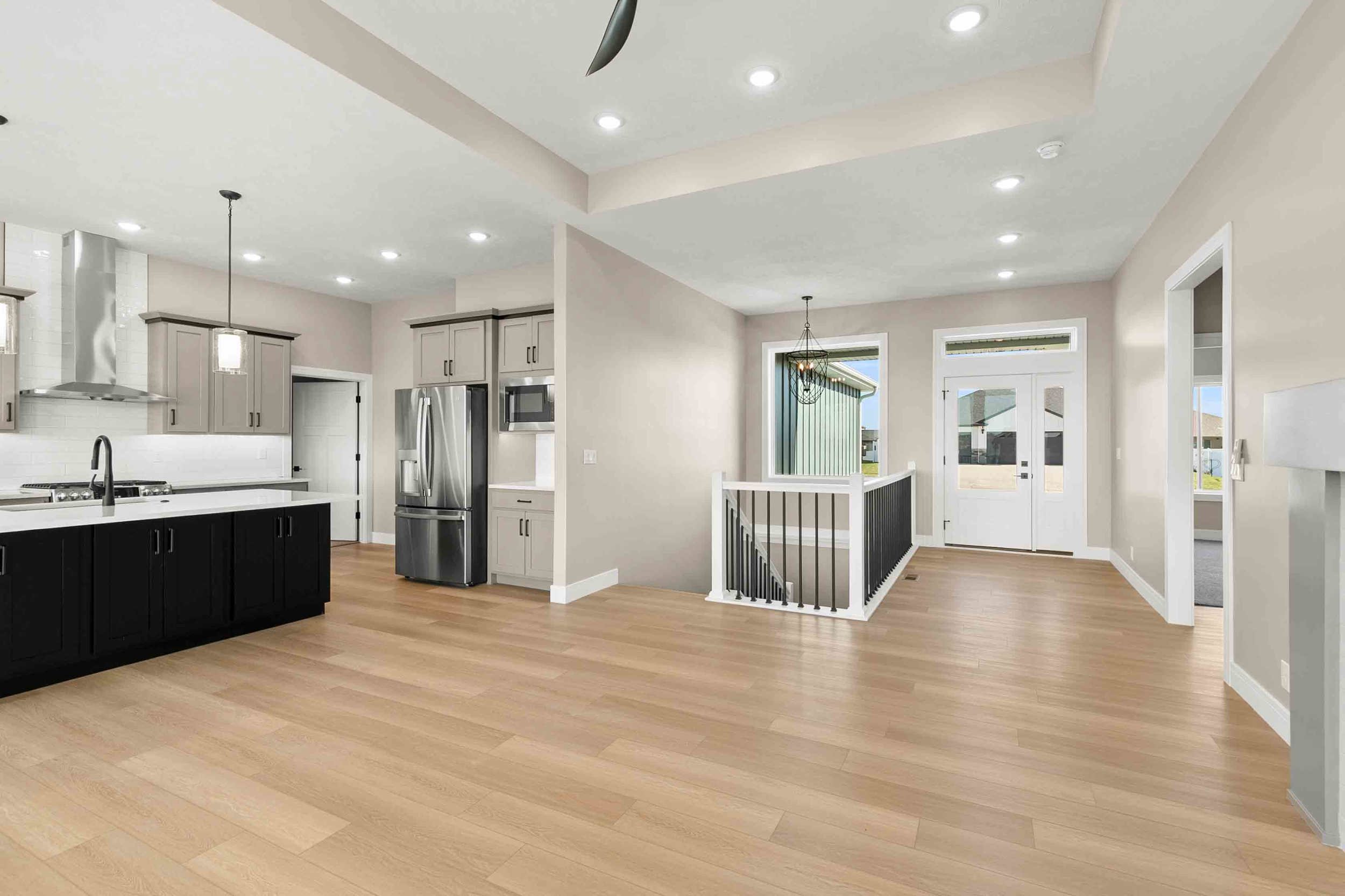 Wide establishing backdrop for a luxury real estate contact page in Lincoln Nebraska: a softly lit, upscale modern-tradi
